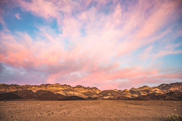Belt of Venus at Death Valley National Park, sunsetting pink sky.