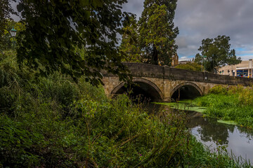A view towards the bridge over the River Eye in Melton Mowbray, Leicestershire, UK in the summertime