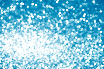blue white glittering Christmas lights. Blurred abstract background