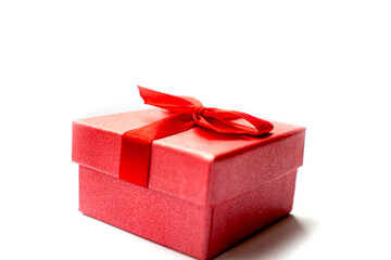 Red gift box with red ribbon for the holiday isolated item on white background