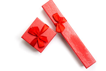 Isolated items two red boxes for decorations with red ribbons for birthday, christmas, wedding on a white background top view