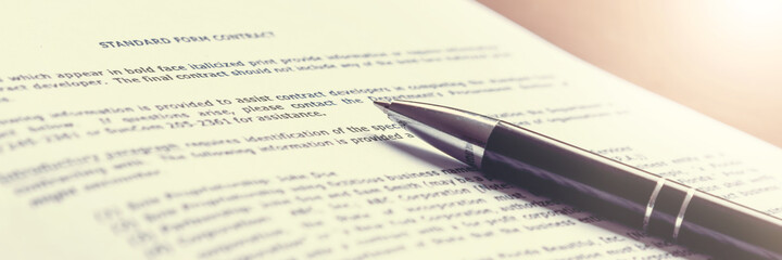 black pen on white paper of standart contract form for signature work and employer concept