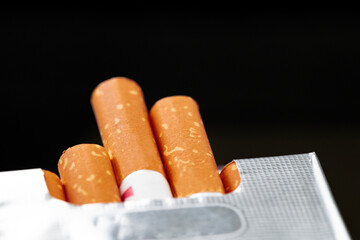Open new pack of cigarettes close up