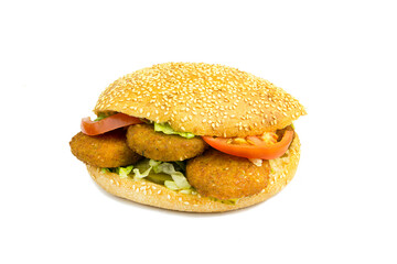 Falafel and fresh vegetables on a white background