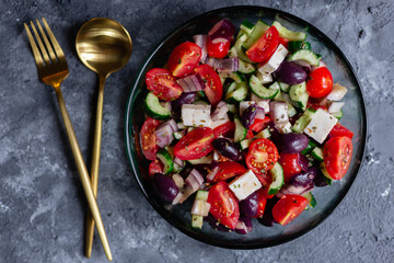 Greek salad on grey surface