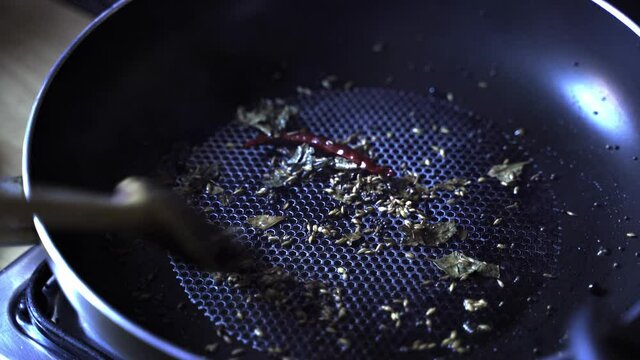 Tadka which is translated to process of spices being Fried prior to cooking of main ingredients in Indian cuisine