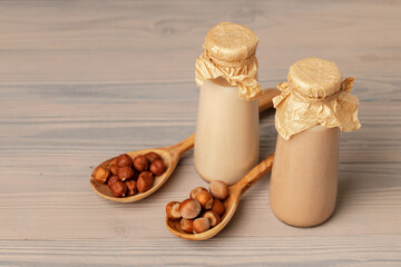 Hazelnut non dairy milk and hazelnuts top view