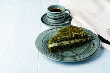 Piece of green spinach cake on plate