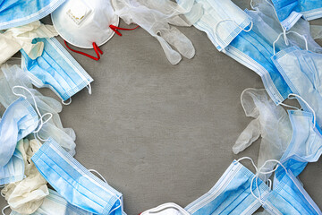 Surgical gloves and medical protective mask on a dark background.