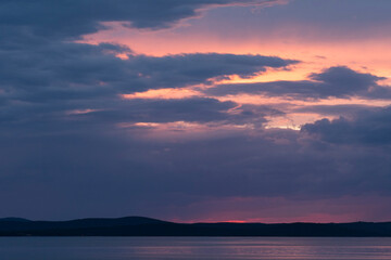 Fototapeta na wymiar ZADAR, CROATIA, OCTOBER, 2020 - Beautiful sunset above the Adriatic sea, the island of Ugljan photographed from Diklo, Zadar, Croatia