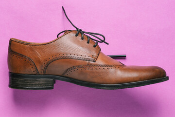 Mens brown Shoe close - up. Elegant and stylish shoes. Accessories and clothing for a gentleman....