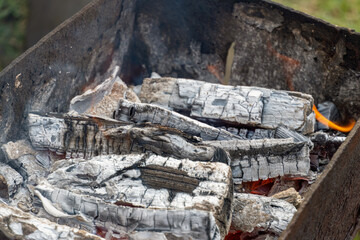 smoldering charcoal close-up in an old brazier