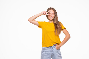 Fototapeta premium Young smiling woman showing victory or peace sign isolated on white background