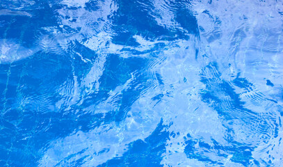 light background in the pool Blue water