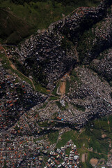 houses and houses advance through mountains and woods