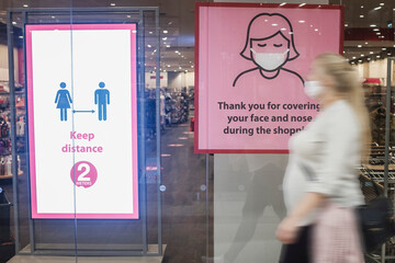 Instruction about safe shopping on the shopwindow in the shopping centre during Covid-19 pandemic....