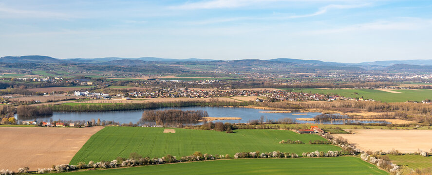 Agricultural landscape with pond and spring fields