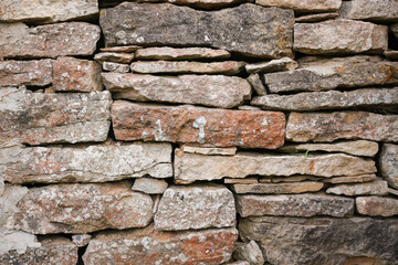 Old stone wall texture background. The stone wall texture background natural color.