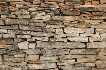 Old stone wall texture background. The stone wall texture background natural color.