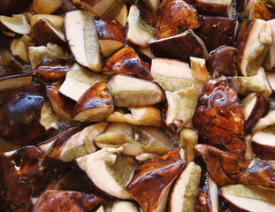 Texture boiled fresh processed mushrooms cooking. Sliced pieces of polish  boletus mushrooms are boiling process cuisine. Harvesting mushrooms for the winter. 