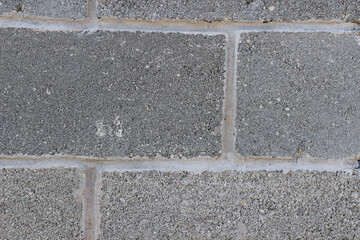 Fototapeta premium Photo of gray natural concrete old wall texture. Grey washed cement surface. Horizontal.