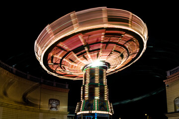 Attractions and light at the amusement park Prater