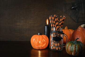 Halloween pumpkin head jack-o-lantern on wooden background
