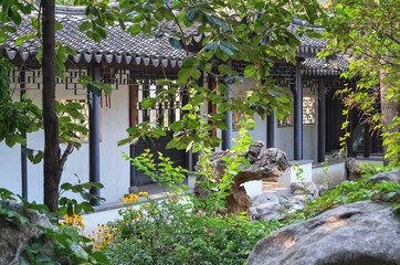 Сozy chinese garden with a pavillion. Selective focus