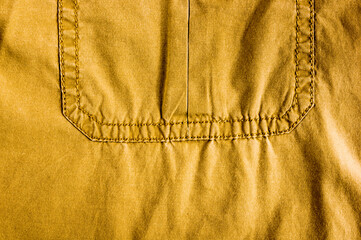 clothing items stonewashed cotton fabric texture with seams, clasps, buttons and rivets, macro