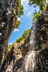 Basalt rocks and pristine water of Alcantara gorges in Sicily, Italy