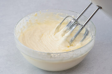 Cream cheese whipped cream  close up in a glass bowl