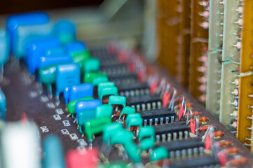 Obraz premium Vintage electronic circuit boards with radio parts and chips, close-up, macro photo