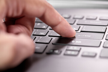  working on computer, close up of hand on keyboard