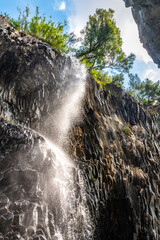 Basalt rocks and pristine water of Alcantara gorges in Sicily, Italy