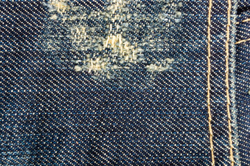 clothing items blue stonewashed faded jeans cotton fabric texture with seams, clasps, buttons and...