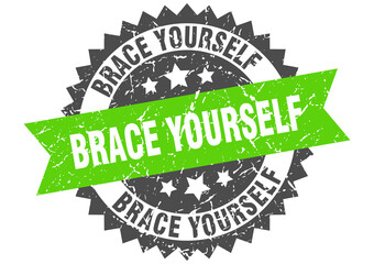 brace yourself stamp. grunge round sign with ribbon
