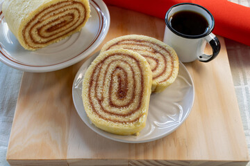 slices of guava roll and coffee mug. typical Brazilian dessert, from the Northeast region. guava cake. view from the top