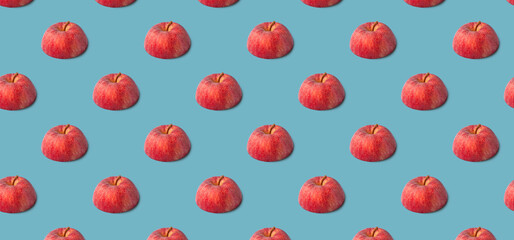 Fruit seamless pattern made of ripe green apples on blue background