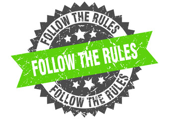 follow the rules stamp. grunge round sign with ribbon