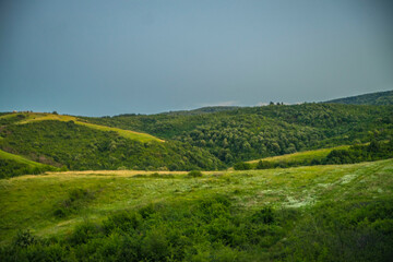 Fototapeta na wymiar landscape with green hills and sky
