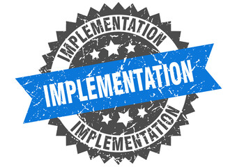 implementation stamp. grunge round sign with ribbon