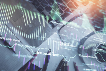 Double exposure of financial chart drawing over table background with computer. Concept of research and analysis. Top view.