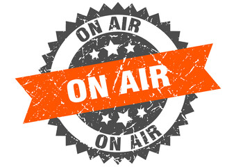 on air stamp. grunge round sign with ribbon