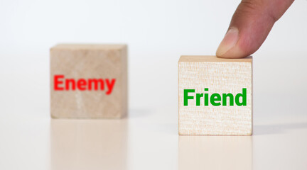 ENEMY word written on wood block