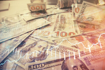 Multi exposure of forex chart drawing over us dollars bill background. Concept of financial success markets.