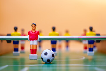 Table Football figures on orange background
