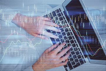 Double exposure of woman hands working on computer and forex chart hologram drawing. Top View. Financial analysis concept.
