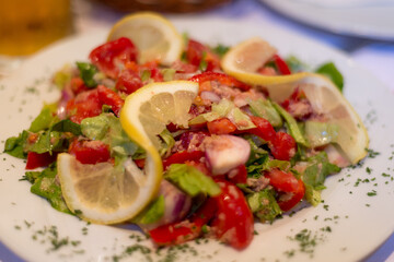 Montenegrin mixed tomato salad with lemon and herbs,Podgorica,Montenegro.