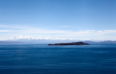 Fototapeta na wymiar Island and mountains in Lake Titicaca