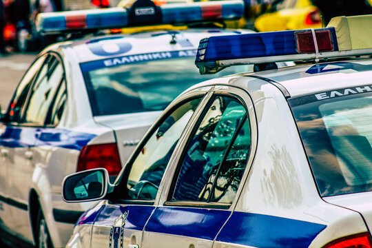 Fototapeta Closeup of an official police car patrolling the streets of the city center of the metropolitan area 